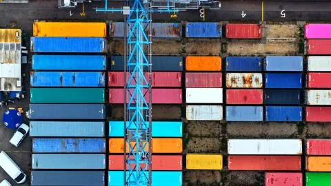Top-Down Container Yard with Gantry Crane and Colorful Freight Stock Photos