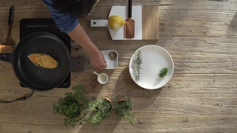 A top-down cooking demonstration shows a... | Stock Video | Pond5