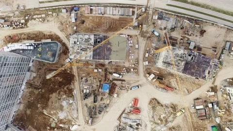 Top down cranes working on building site. Flyover constructions development Stock Footage 152529655