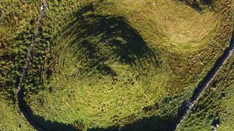 Top Down Creative Drone Shot of man made hill in Nature with Sheep Stock Footage 229748502