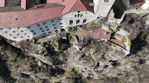 Top-Down Descending Drone Flight from Monastery Facade into Ravine in So Vídeo Stock 335579591
