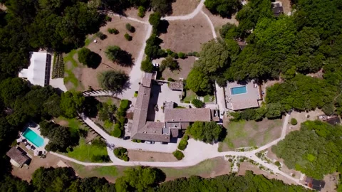 Top-down descending shot overhead a large condo with multiple pools in Uzes Stock Footage 281216817