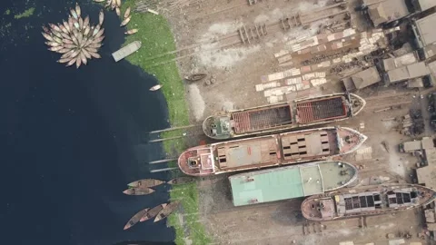Top Down Descent Over Beached Ships and Small Wooden Boats on Buriganga River Video stock 327265854