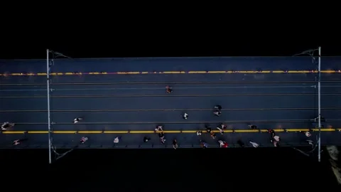 Top down Dom Luis I Bridge upper deck with metro tracks and pedestrians in Stock Footage 333605371