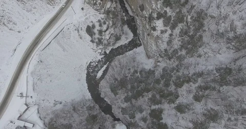 Top down. Drone Aerial Flight in the mountains in winter. Mountain road Stock Footage 94621944