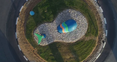 Top down drone aerial view of traffic roundabout or road traffic circle with Stock Footage 128255972