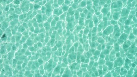 Top down drone aerial view of water ripple patterns on shallow ocean floor Stock-Footage 302575897
