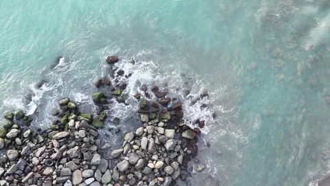 Top Down Drone Aerial View of Clear Turquoise Sea Water Crashing Stock Footage 345953248