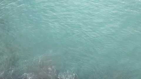 Top Down Drone Aerial View of Churning Turquoise Sea Waves and White Foam Stock Footage 345953380