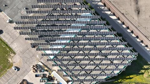 Top-Down Drone Aerial View of Rooftop Solar Panel Rows Stock Photos