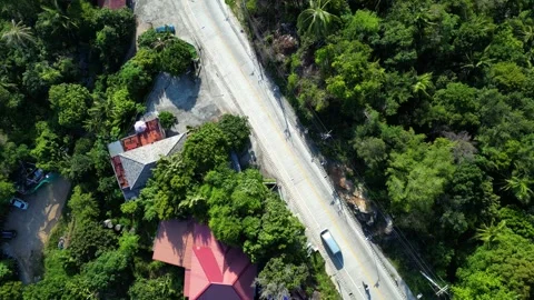 Top-Down Drone Ascending Above Coastal Road Near Haad Rin Beach, Koh Phangan Stock Footage 339403472