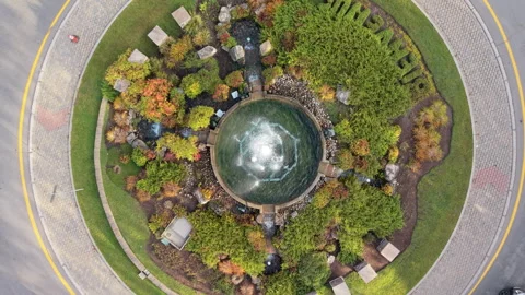 Top Down Drone Ascending Over Roundabout Fountain in Mont Tremblant Stock Footage 321378272