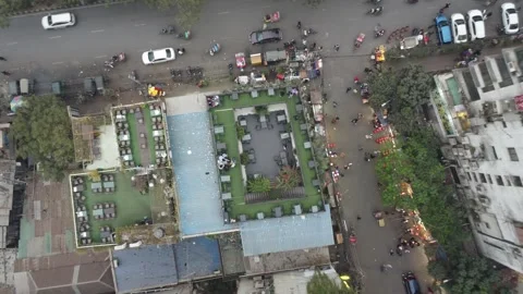 Top Down Drone Ascent Over Rooftop Bar and Street Life in Mirpur, Dhaka Video stock 327615349