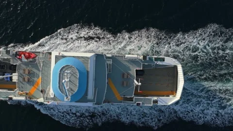 Top-down drone capture of ferry sailing from island in Norway Stock Footage 320576948