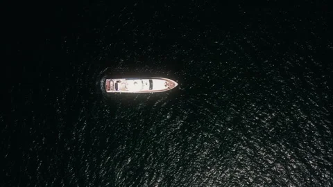 Top down drone circling and rising above luxury yacht in Dubai Stock-Footage 345097252