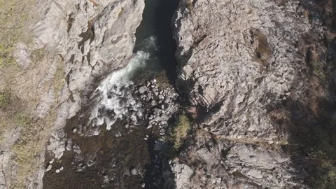 Top Down Drone Descent Over Rocky River Gorge – Aerial Nature 4K Stock Footage 325411162