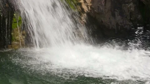 Top down Drone flight of against the backdrop of a small waterfall in the forest Stock Footage 236962354