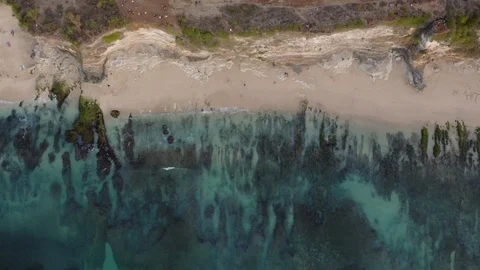Top down drone flight over coast of indian ocean, Bali, Indonesia, 4k Stock Footage 122197252
