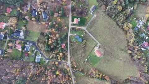 Top-Down Drone Flight Over Rural Village – Houses, Roads, Fields Stockbeeldmateriaal 321055434