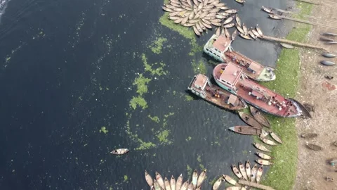 Top Down Drone Flight Over Traditional Boats on Buriganga River in Dhaka Video stock 327229262