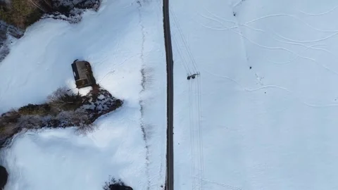 Top-down drone flight over a secondary mountain road with small curves 스톡 동영상 329506165