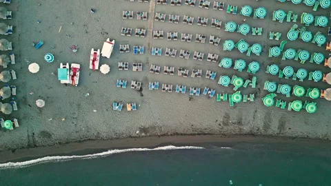 Top Down Drone Flight Sideways Over Velipoja Beach Umbrellas and Sea Stock Footage 342285458