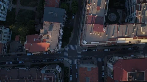 Top down drone flyover of city blocks, crossroad with crosswalks, Nice, France Stock Footage 347413801