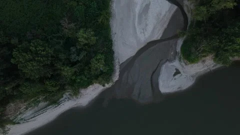 Top-down drone flyover of drought-exposed Po River side channel at the Stock Footage 339025854