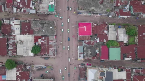 Top-down drone following road in Brazzaville, Congo Видео 331999287
