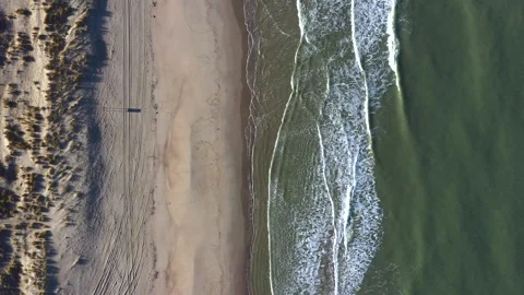 Top-down drone footage of a beach on the North Sea coast, Netherlands Video stock 302363260