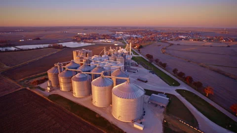 Top-down drone footage of an expansive grain elevator and silo complex Stock Footage 328694722
