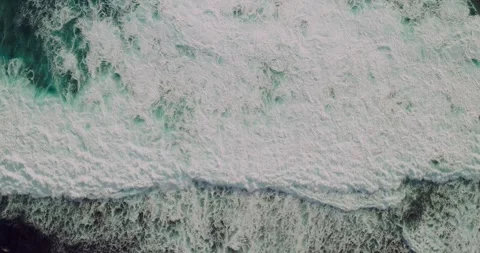 Top Down Drone Footage of Ocean Waves Forming Organic Sea Patterns Stock Footage 330589935