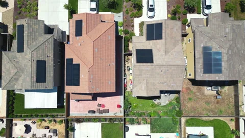 Top down drone footage over homes in a neighborhood Stock Footage 246974835