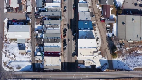 Top-Down Drone Footage of a Small Town in Winter With Snow-Covered Roads and Stock-Footage 296515527