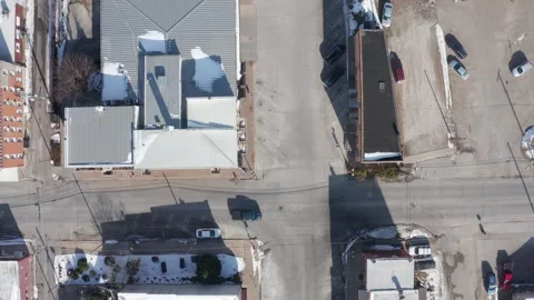 Top-Down Drone Footage of a Small Town in Winter With Snow-Covered Roads and Stock-Footage 296515571