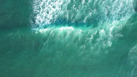 Top-down drone footage of wave breaking Stock Footage 244350218