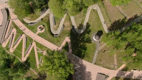 Top down drone orbit over park pathways 動画素材 331740494