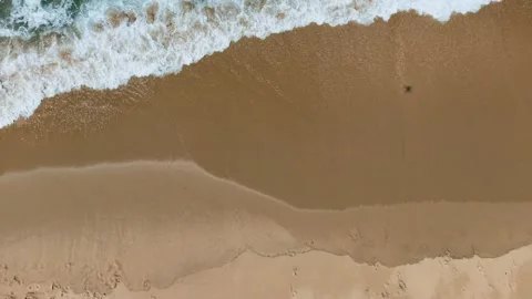 Top-Down Drone Panning Over Breaking Waves And Sand Beach Horizontal 4K Stock Footage 341349080