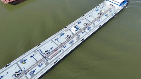 Top down drone pass above gas tanker on river Stock Footage 331896133