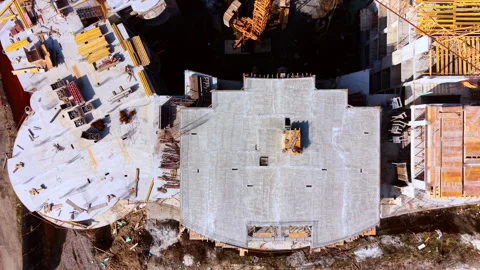 Top down drone perspective of apartment building foundation Video stock 335690541