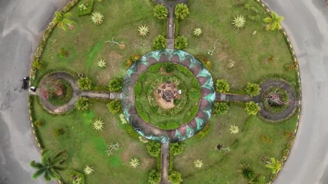 A top-down drone perspective of a circular road junction or roundabout Stock Footage 330465668