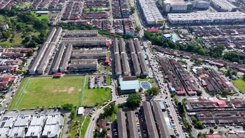 A top down drone perspective of the vibrant rooftops and organized street 動画素材 332086827