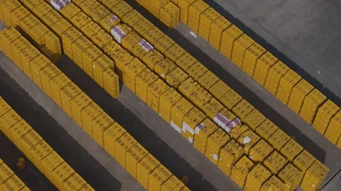Top down drone reveal of stacked precast construction blocks in factory yard Stock Footage 334712158