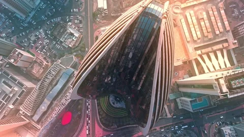 Top-Down Drone of Ribbed Skyscraper, Kuwait City—Glass Teardrop Facade Above Stock Footage 324899414