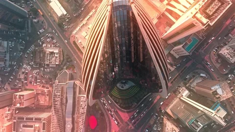 Top-Down Drone of Ribbed Skyscraper, Kuwait City—Sunlit Fins and Symmetric Stock Footage 324950991