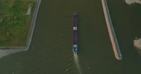 Top-Down Drone Rise from Cargo Ship Revealing Dutch Polder Landscape and Canal Stock Footage 341424775