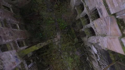 Top down drone rise from inside the abandoned Lennox Castle ruins in Scotland 動画素材 308792078