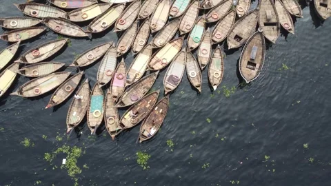 Top Down Drone Rise Over Clustered Wooden Boats with People on Buriganga River Video stock 327234034