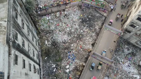 Top Down Drone Rise Over Garbage Filled Streets and Urban Life in Dhaka Stock Footage 327273001