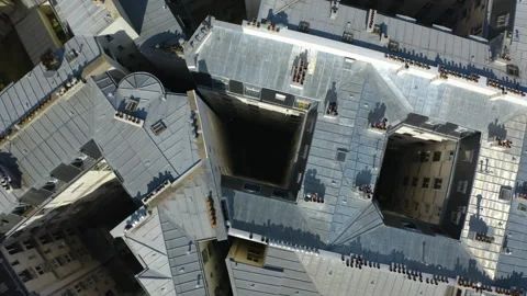 Top down drone shot above apartment building roofs in Paris, sunny day in Stock Footage 277007071